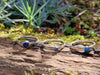 Sterling silver Blue stones stacking ring set. Lapis Turquoise Blue Onyx. Sitting on a mossy log in the sunshine.