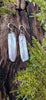 Medium1 melt drop silver earrings on a mossy log