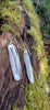 Medium2 melt drop silver earrings on a mossy log