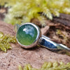 sterling silver 6mm Moss agate stacking ring on a mossy log