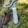 Medium Straight sterling silver melt textured pendant on a chunky silver spiga chain. the necklace lies on a mossy woodland log.