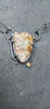An oxidised sterling silver chain necklace with a shield-shaped natural edge ocean jasper pendant and a small round citrine stone, displayed on a slate surface.
