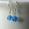 silver and Blue onyx bead single drop earrings on a white background