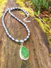 green seaglass pendant on pearls