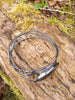 Black Silver twisted tendril bangle with blue green flash labradorite