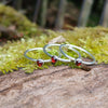Sterling silver and Garnet set of 3 tiny stackers on a mossy log