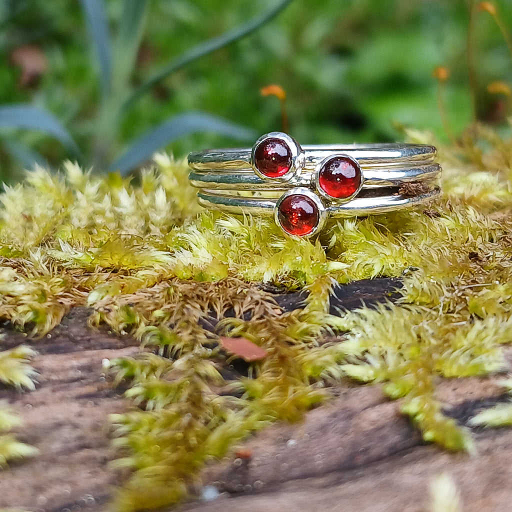 Sterling silver and Garnet set of 3 tiny stackers on a mossy log