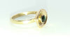 Gold cup ring with green stone