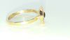Gold cup ring with green stone