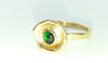 Gold cup ring with green stone