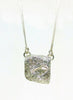 Silver rock textured pendant