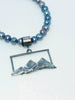 Textured silver mountain landscape pendant on pearls