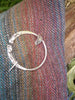 Penannular pin with leaf